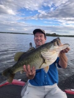 man holding twelve pound large mouth bass